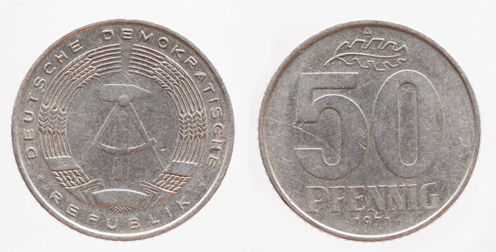 Germany East GDR - circa 1971: a 50  Pfenning coin of the GDR with the Hammer and Zirkle coat of arms of the GDR and oak leaves on the number 50