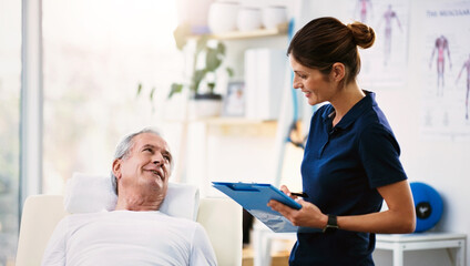 Working together to ensure he stays as healthy as possible. Shot of a young female physiotherapist doing a consultation and assessment of a senior patient.