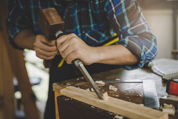 Craftsman planing wood for make homemade furniture as hobby