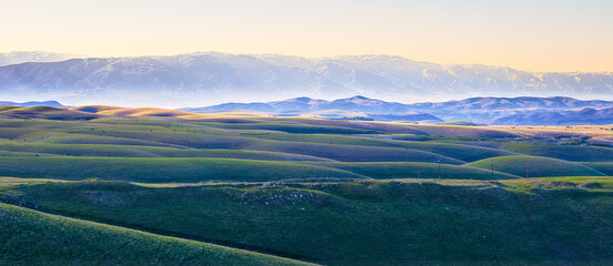 rolling hills landscape in the evening