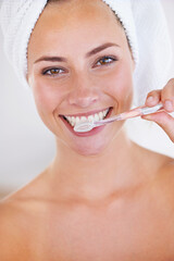 Disciplined brushing equals sparkling teeth. Portrait of a stunning woman brushing her teeth.