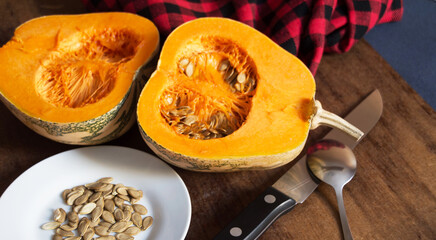 Sliced pumpkin and seeds on the table