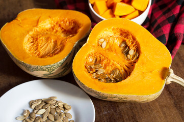 Pumpkin pieces and seeds on the table