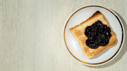 Toasts with jam on natural fabric background