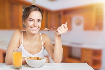 Young calm smiling happy housewife woman eat breakfast. Healthy diet lifestyle concept