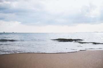 Landscape image of tropical white beach with blue sea and sky background