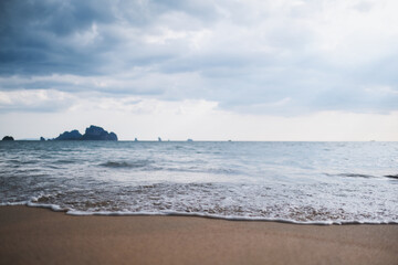 Landscape image of tropical white beach with blue sea and sky background