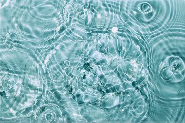 Blue Water splash texture. Sunshine rippled surface perfect for swimming pool spa marketing