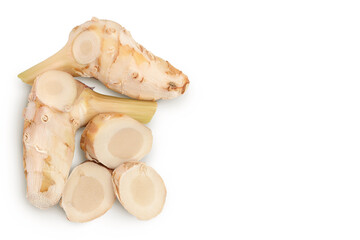 Fresh galangal root with slices isolated on white background with clipping path. Top view with copy space for your text. Flat lay