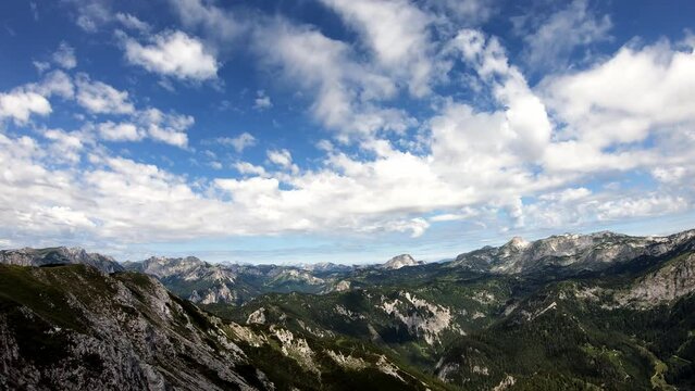 Timelapse of scenic view from Messnerin on Hochtor and alpine mountain chains in Styria, Austria, Hochschwab region. Clouds are moving over the mountain peaks. Summer day. Hiking in Alps, Tragoess
