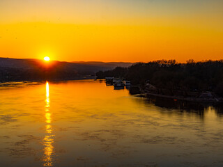 Fototapeta na wymiar Sunset over calm Danube river in Novi Sad, Serbia
