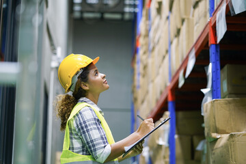 Worker inventory inspect staff checking stock and inspect package box with checklist in warehouse...