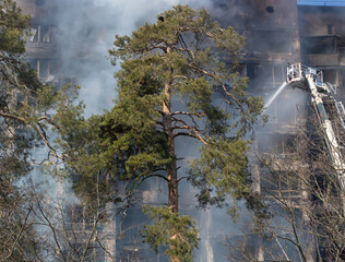 War in Ukraine. Firefighters on damaged residential building in Kyiv