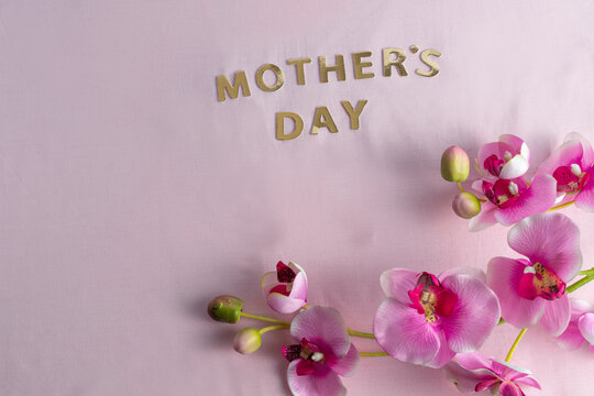 Mother's day with flowers on light pink background