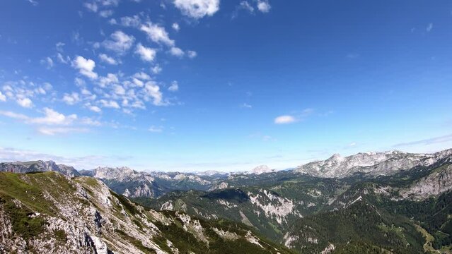 Timelapse of scenic view from Messnerin on Hochtor and alpine mountain chains in Styria, Austria, Hochschwab region. Clouds are moving over the mountain peaks. Summer day. Hiking in Alps, Tragoess
