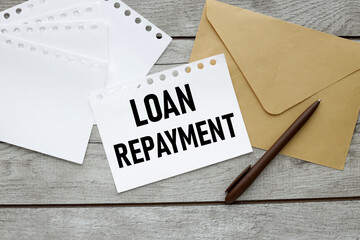 paper with text on envelope LOAN REPAYMENT