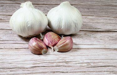 Fresh garlic on a rustic wooden table. Garlic cloves