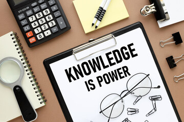 knowledge is power text on folder on white paper