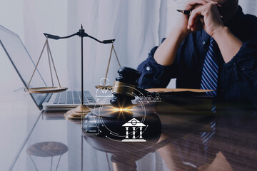 Male lawyer working with contract papers and wooden gavel on tabel in courtroom. justice and law ,attorney, court judge, concept.