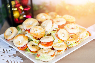 christmas snack donit bread with meat and vetgy with blur decorate red and yellow background