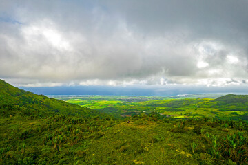 Aerial view of the south coast of Mauritius island from a hill located near Piton Savanne	