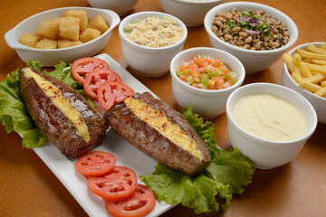 Sun meat and side dishes. Carne de sol, salted steak, typical dish from the Brazilian northeast.