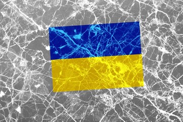 An image of the flag of Ukraine on a wall with a crack. A crisis.