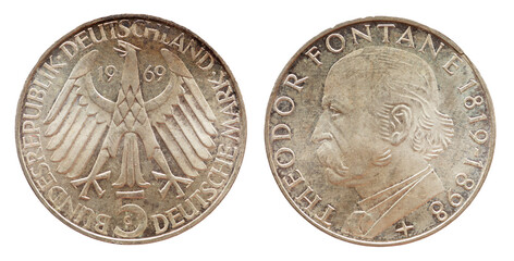 Germany - circa 1969: a 5 Deutsche Mark coin of the Federal Republic of Germany with the cote of arm eagle and a portrait of the German writer, journalist and critic Theodor Fontane