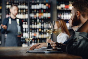 Closeup glasses White wine tasting in restaurant with lecture from male sommelier