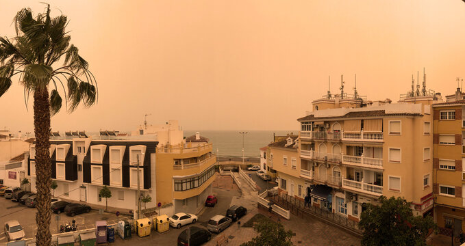 Panoramic view of Mediterranean Spain covered by Sahara dust storm or calima creating pollution and respiratory problems.