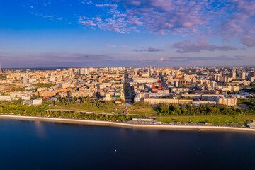 Aerial top view panorama city Perm and central embankment of Kama river Russia, sunset drone photo