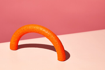 Minimal 3-dimensional compoition against pink background, copy space