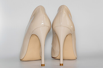 Back view of the nude beige colored high heeled women's shoes.