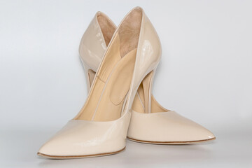 Front view of the nude colored high heeled women's shoes.