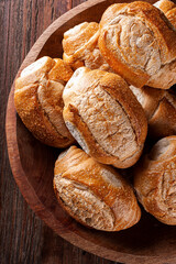 Several french breads in a basket. Photo up close.