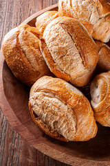 Several french breads in a basket. Photo up close.
