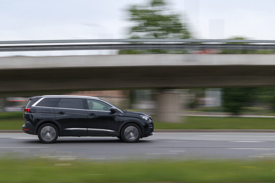 Peugeot 5008 on the street. Motion blur. Riga, Latvia - 20 May 2021