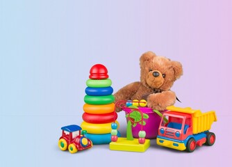 Cute kid toys. Container with bear, blocks on light background. Cute toys collection for small children. Donation.