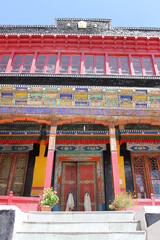 Historical and colorful entrance to a traditional buddhist temple in the himalaya region in asia 