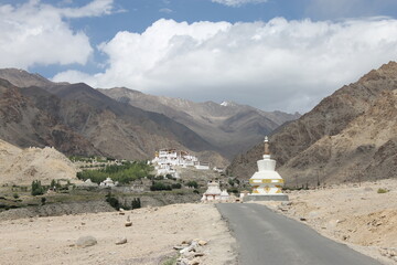 Way to the buddhist white stupa in Leh Ladakh in India with himalayan mountains in the background 