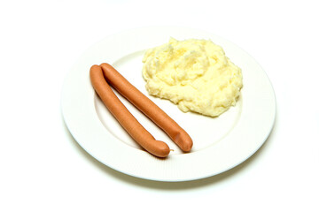 The simple, cheap and fast dish, the couple of wieners with mashed potatoes. Isolated in a white background. 