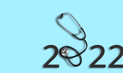 Background with stethoscope and numbers 2022. happy new year 2022. health medical concept