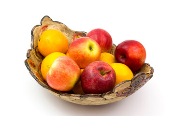 fresh fruits on a clay plate