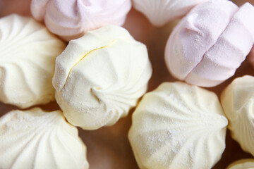 Freshly prepared packaged multicolored air marshmallow according to a classic recipe at a confectionery factory, lies for sale to customers, top view