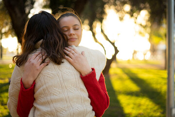 LGBTI couple hugging each other in the park