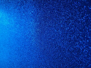 Blue gradient background with blurred glitter.