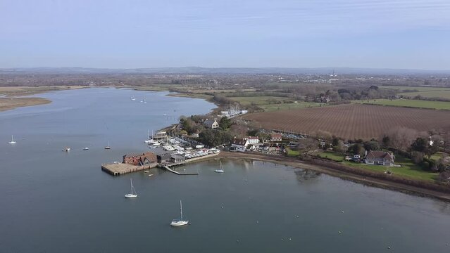 Dell Quay in southern England, a sailing destination in Chichester Harbour with the Crown and Anchor 16th century pub on the shore line.