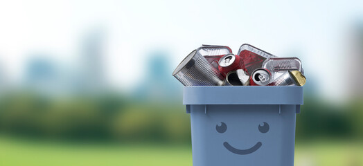 Smiling trash bin full of metal waste
