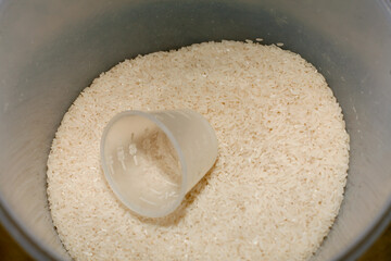 white rice with measuring cup