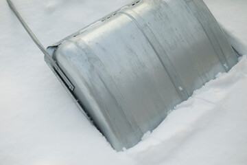 Metal shovel for snow removal. Tool for clearing snowdrift.